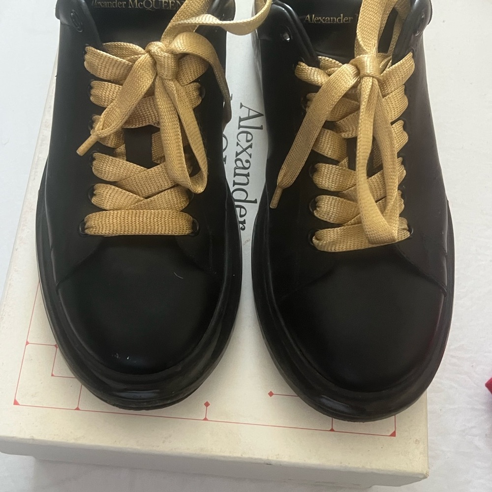 Alexander McQueen Glossy Black Shoes with Gold Laces